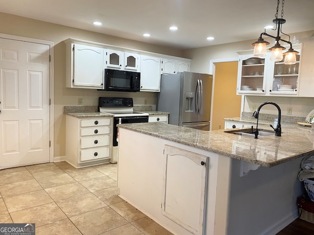 kitchen with kitchen peninsula, stainless steel fridge, sink, electric range, and white cabinetry