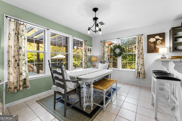 sunroom with a notable chandelier