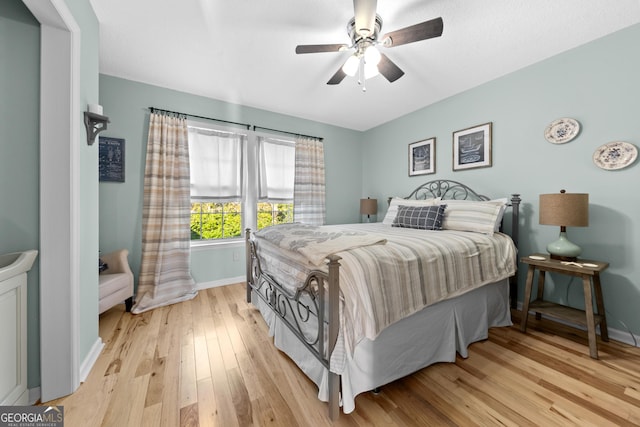 bedroom featuring ceiling fan and light hardwood / wood-style floors