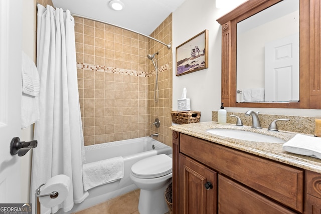 full bathroom featuring tile patterned floors, toilet, shower / bath combo with shower curtain, and vanity