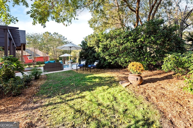 view of yard featuring a patio and an outdoor hangout area