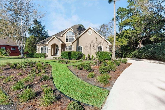 view of front of property with a front lawn