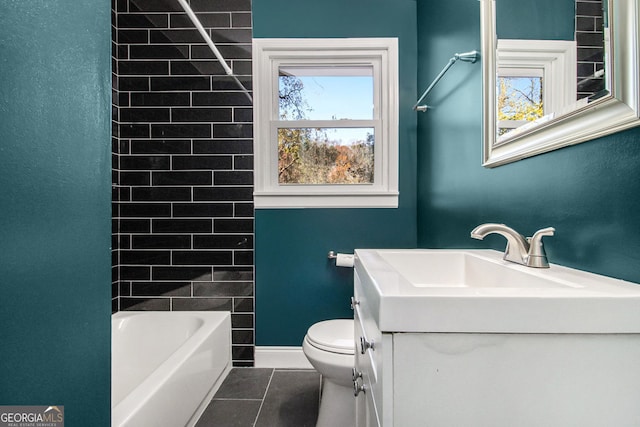 full bathroom with toilet, vanity, tile patterned floors, and tiled shower / bath combo