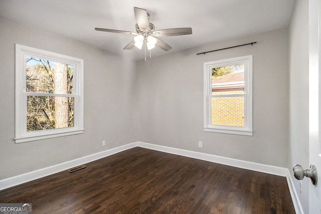 unfurnished room featuring dark hardwood / wood-style floors and ceiling fan