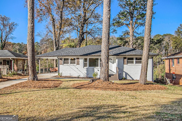 single story home featuring a carport and a front yard