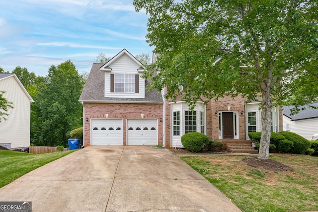 view of front of property featuring a front lawn and a garage