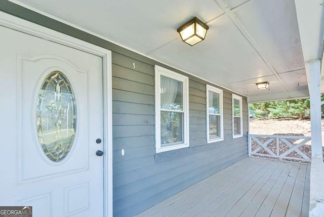 property entrance featuring covered porch