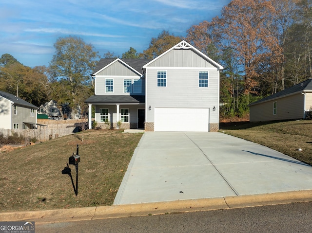 view of front of home featuring a garage, driveway, covered porch, a front lawn, and board and batten siding