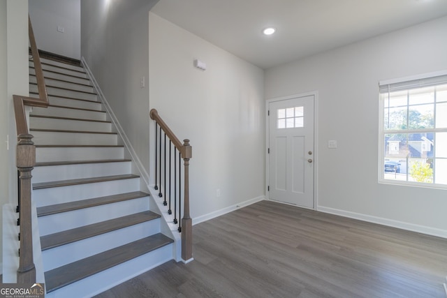 entryway featuring stairs, recessed lighting, baseboards, and wood finished floors