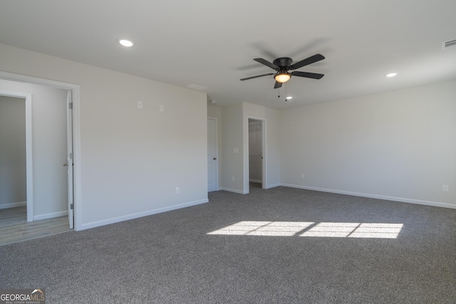 spare room featuring ceiling fan, recessed lighting, carpet flooring, visible vents, and baseboards