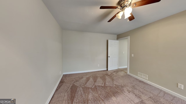 carpeted empty room with ceiling fan