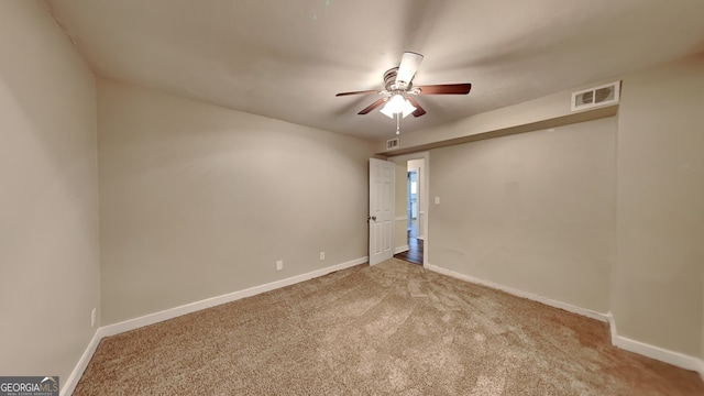 carpeted empty room with ceiling fan