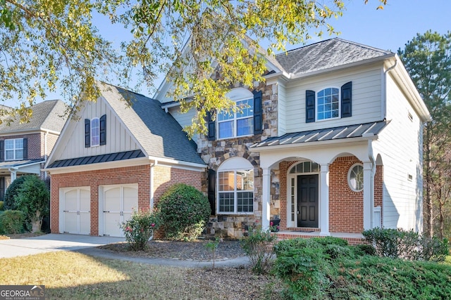 view of front of property with a garage and a front lawn