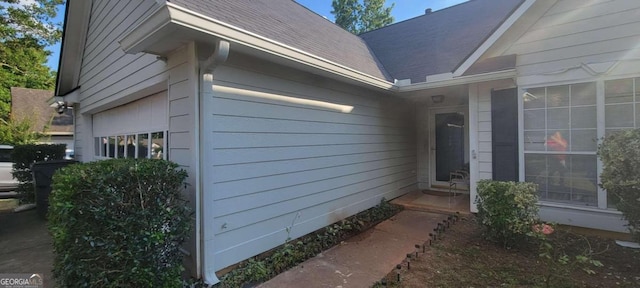 view of side of property with a garage