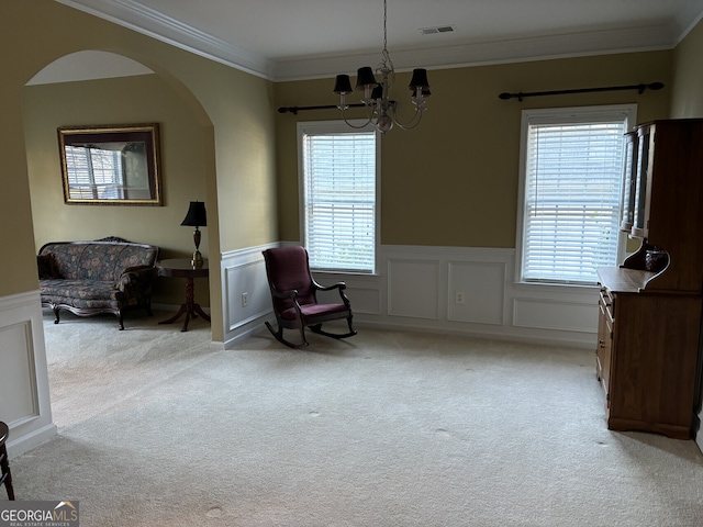 sitting room featuring a wealth of natural light, light carpet, and ornamental molding