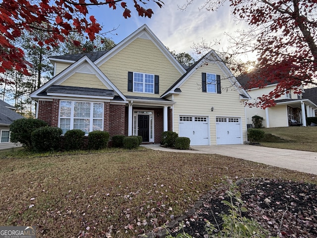 view of front of property featuring a garage and a yard