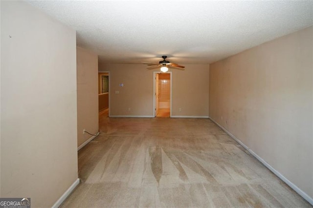 carpeted spare room with a textured ceiling