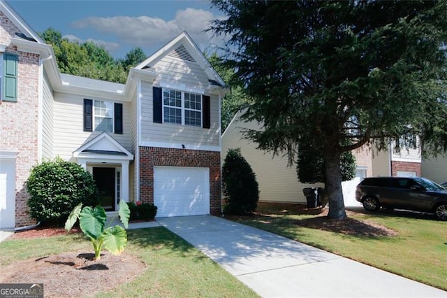 view of front of home with a front lawn and a garage