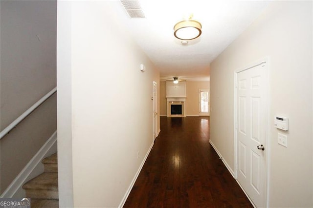 corridor featuring dark hardwood / wood-style floors