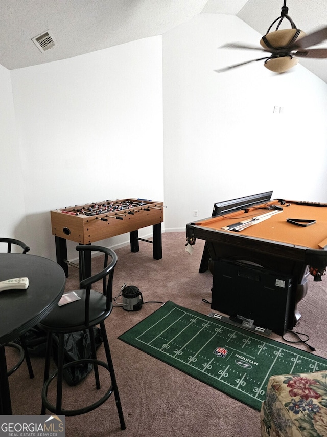 playroom featuring carpet flooring, ceiling fan, a textured ceiling, and lofted ceiling