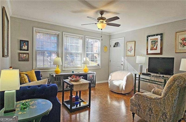 living room featuring ceiling fan and crown molding