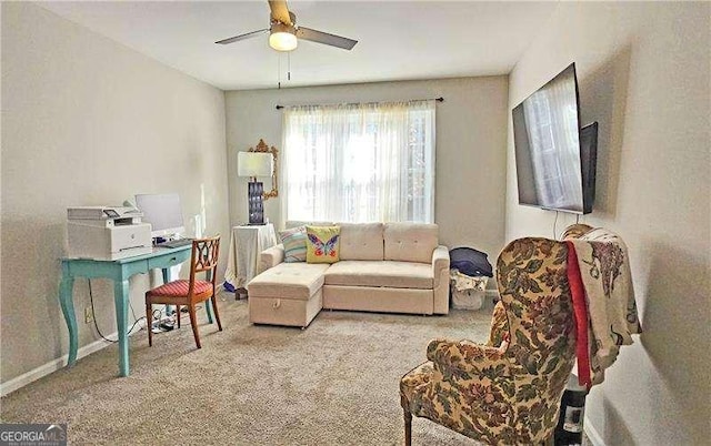 living room featuring carpet flooring and ceiling fan