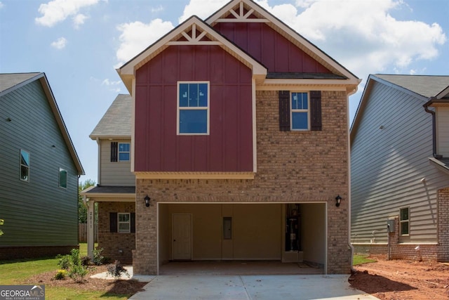 craftsman inspired home with a garage and water heater