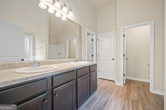 2275 Lovejoy Rd Lot 72, Hampton, GA 30228 - bathroom with double vanity, a shower, wood finished floors, lofted ceiling, and baseboards