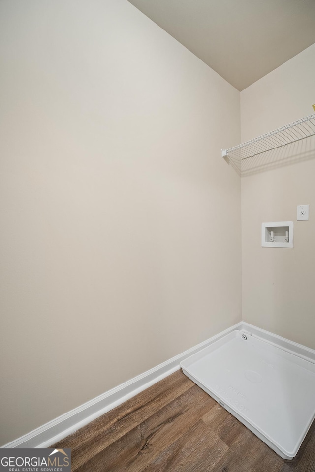 laundry room featuring wood-type flooring and washer hookup