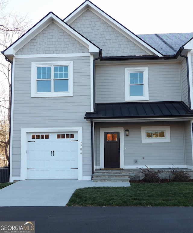 view of front of property with a garage