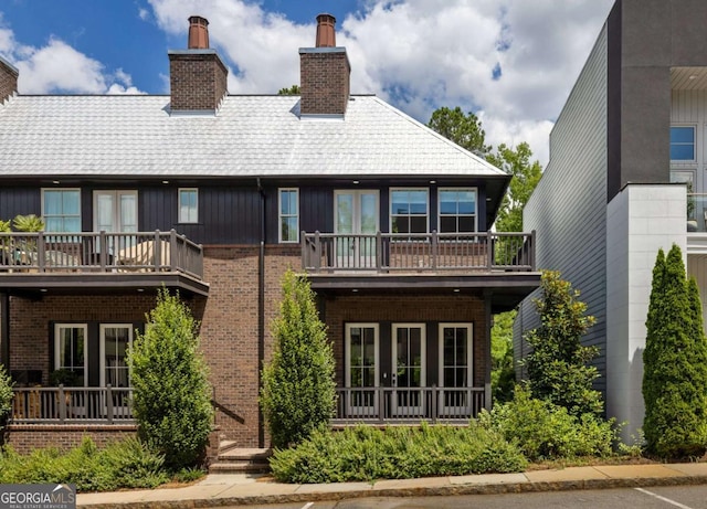 back of house featuring a balcony