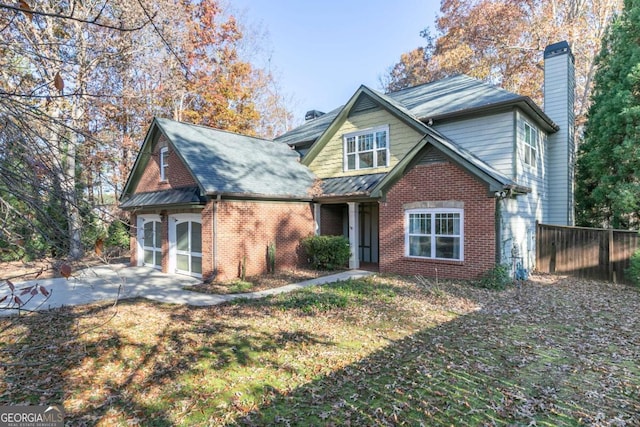 view of front facade with a front yard and a garage