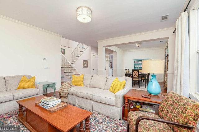 living room with ornamental molding