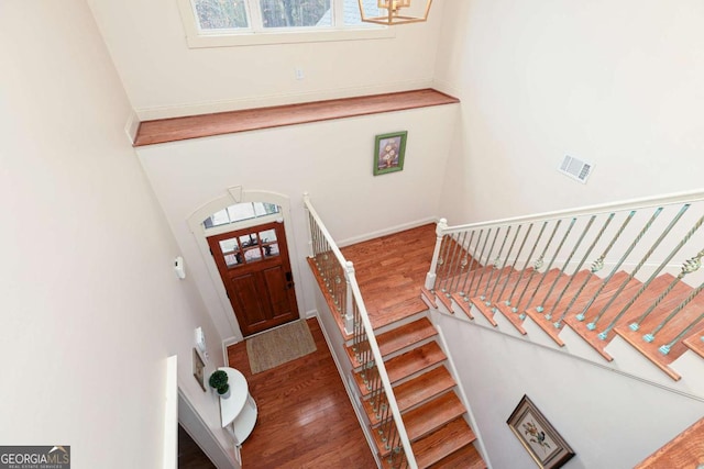 foyer featuring a notable chandelier and wood-type flooring