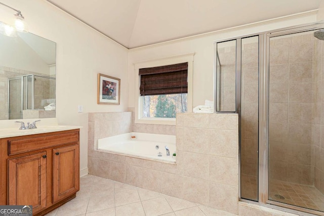 bathroom with separate shower and tub, tile patterned flooring, vaulted ceiling, and vanity