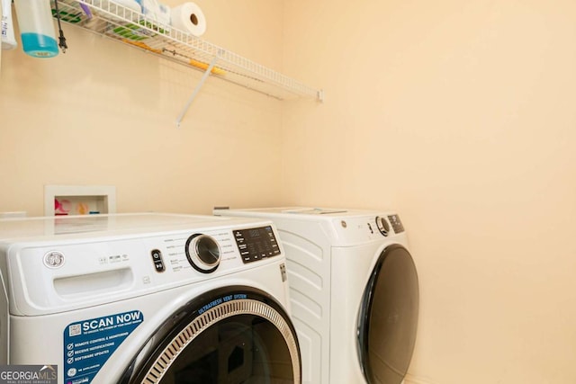 washroom featuring independent washer and dryer