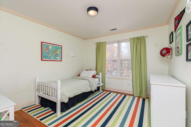 bedroom with ornamental molding