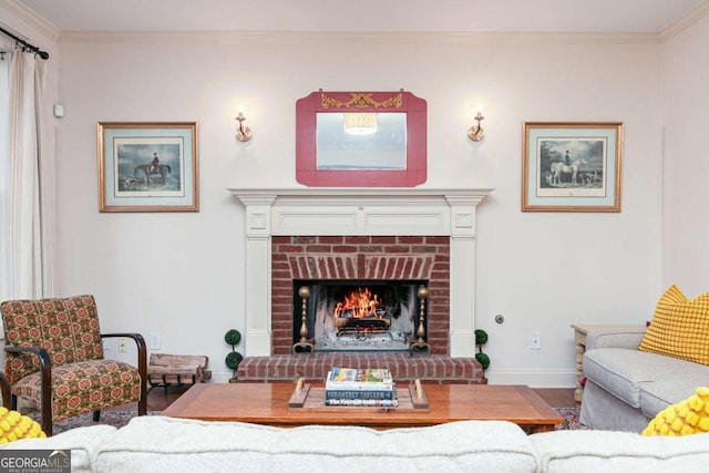 living room with wood-type flooring, a fireplace, and crown molding