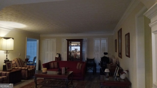 living room featuring crown molding and hardwood / wood-style flooring