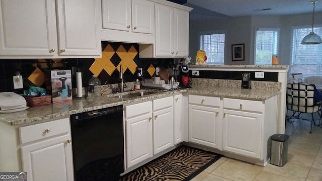 kitchen featuring decorative light fixtures, white cabinetry, black dishwasher, sink, and kitchen peninsula