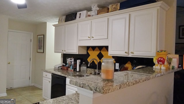 kitchen with white cabinetry, dishwasher, sink, light stone counters, and kitchen peninsula