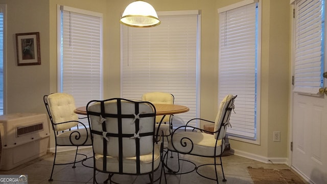 dining room with light tile patterned flooring