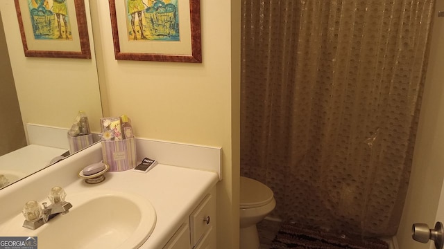 bathroom with vanity and toilet