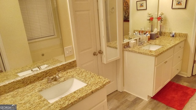 bathroom with hardwood / wood-style flooring and vanity