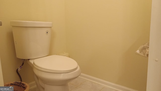 bathroom with tile patterned floors and toilet