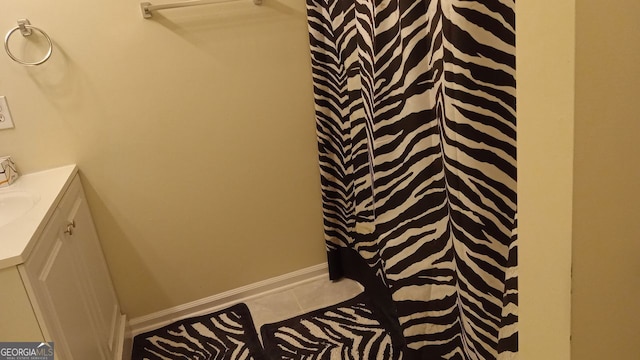 bathroom with vanity and tile patterned flooring