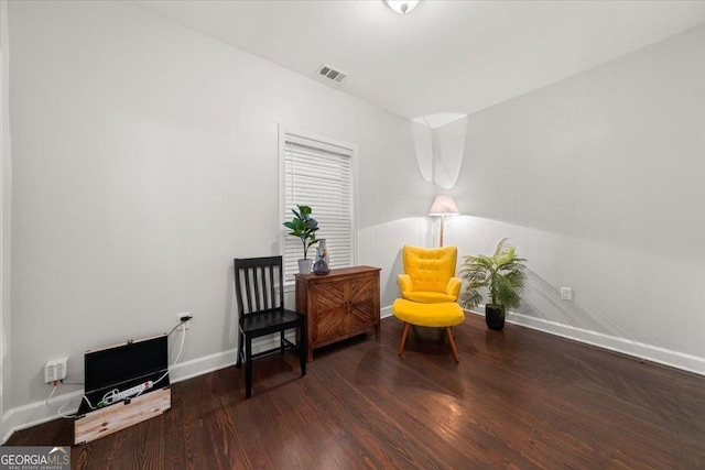 sitting room featuring dark hardwood / wood-style flooring