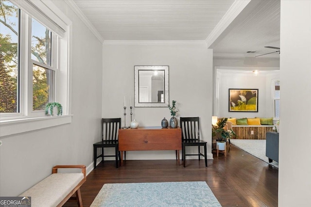 living area featuring crown molding, ceiling fan, and dark wood-type flooring