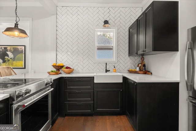 kitchen featuring sink, stainless steel appliances, dark hardwood / wood-style floors, crown molding, and decorative light fixtures