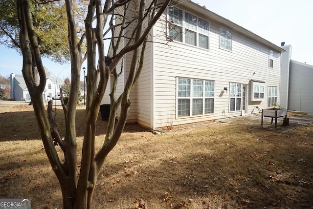 back of property featuring a patio